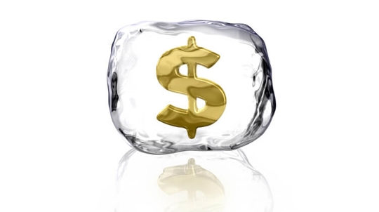 Frozen dollar sign symbolizing "freezing assets"