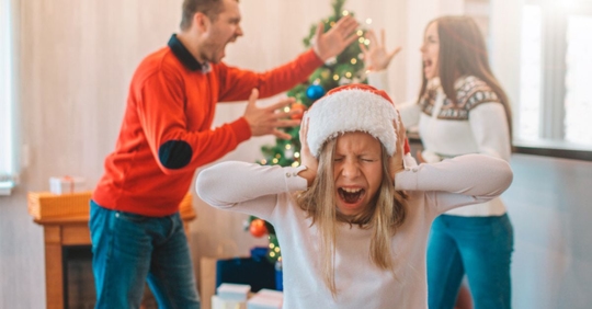 parents arguing in front of child at Christmas