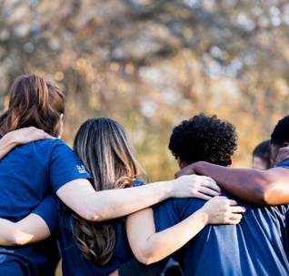 four children hugging