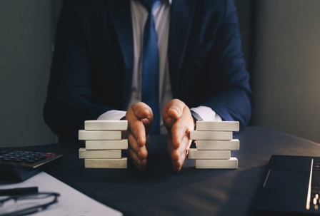 money on table divided by hands