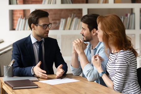 Professional male lawyer consulting couple