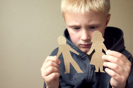 Child holding two stick figures