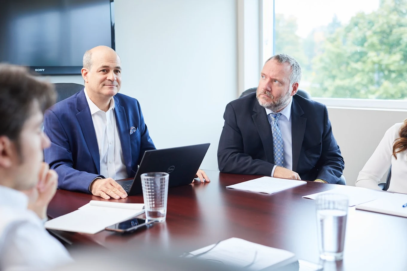 Andrew Feldstein and a senior associate in the Vaughan conference room