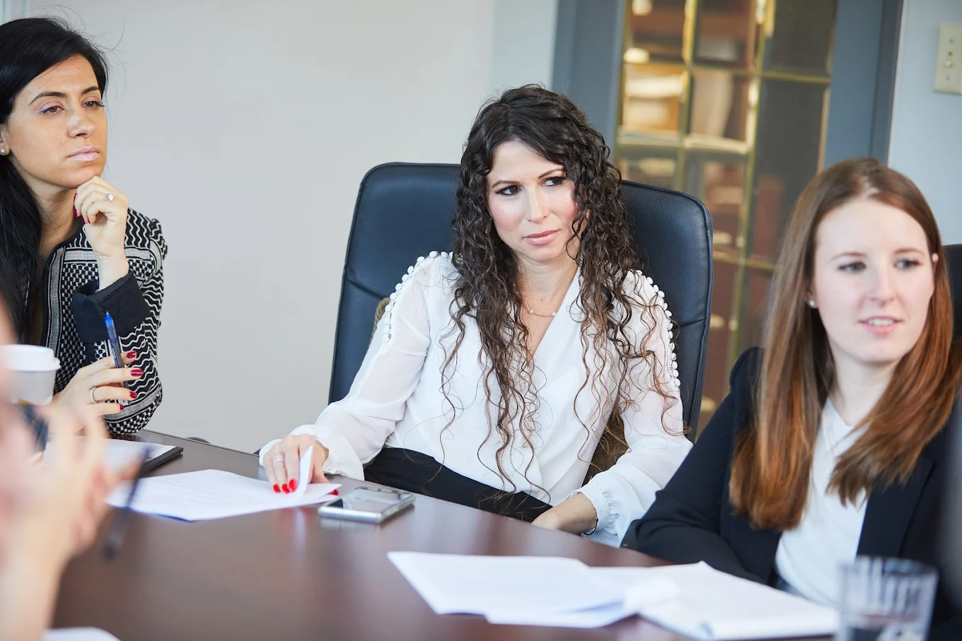 Members of the Feldstein Family Law Group team in a Vaughan conference room meeting